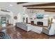 Spacious living room showcasing high ceilings, exposed beams, fireplace, and comfortable seating at 22402 N 84Th Pl, Scottsdale, AZ 85255