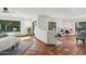 Spacious living room featuring a fireplace, tile flooring, and ample natural light at 22402 N 84Th Pl, Scottsdale, AZ 85255
