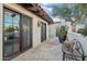 Charming patio with stone flooring, potted plants, and comfortable seating, perfect for relaxing outdoors at 22402 N 84Th Pl, Scottsdale, AZ 85255