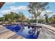 Sparkling pool surrounded by lush greenery, featuring lounge chairs and desert landscaping for a private oasis at 22402 N 84Th Pl, Scottsdale, AZ 85255