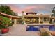Stunning backyard pool with stone accents and desert landscaping, perfect for relaxation and entertaining at 22402 N 84Th Pl, Scottsdale, AZ 85255