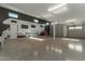 Large garage featuring epoxy flooring, wall mural, and plenty of parking at 27629 N 176Th Dr, Surprise, AZ 85387
