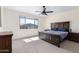 Spacious bedroom with a large window for natural light and ceiling fan for added comfort at 2831 W Carson Rd, Phoenix, AZ 85041