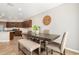 Well-lit dining area with tile flooring, and views of the kitchen at 2831 W Carson Rd, Phoenix, AZ 85041