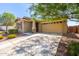 Attractive home exterior showcasing a spacious driveway and a well-maintained front yard with desert landscaping at 2831 W Carson Rd, Phoenix, AZ 85041