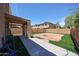 A private backyard featuring artificial grass and a stone patio perfect for gatherings at 2912 E Eberle Ln, Phoenix, AZ 85032