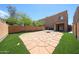 Great backyard for entertaining with a firepit, artificial turf, and block fence at 2912 E Eberle Ln, Phoenix, AZ 85032