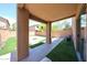 Covered patio overlooking a beautiful backyard with pavers, perfect for outdoor entertaining at 2912 E Eberle Ln, Phoenix, AZ 85032
