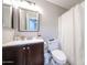 Neutral bathroom features vanity, mirror and toilet with shower/tub combination at 2912 E Eberle Ln, Phoenix, AZ 85032