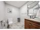 Cozy bathroom showcases a single sink vanity with ample lighting and decorative mirror at 2912 E Eberle Ln, Phoenix, AZ 85032