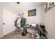 Comfortable bedroom featuring bright window, desk and closet space at 2912 E Eberle Ln, Phoenix, AZ 85032