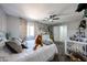 Well-decorated bedroom with decorative plants, a crib, and ample natural light at 2912 E Eberle Ln, Phoenix, AZ 85032