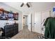Comfortable bedroom featuring bright window, desk and closet space at 2912 E Eberle Ln, Phoenix, AZ 85032
