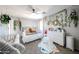 Inviting bedroom with neutral decor, decorative plant life, and a crib at 2912 E Eberle Ln, Phoenix, AZ 85032