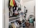 Organized walk-in closet with shelving and hanging storage space for clothes at 2912 E Eberle Ln, Phoenix, AZ 85032