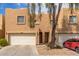 Inviting townhome with two-car garage and charming desert landscaping for a welcoming curb appeal at 2912 E Eberle Ln, Phoenix, AZ 85032