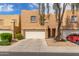 Inviting townhome with two-car garage and charming desert landscaping for a welcoming curb appeal at 2912 E Eberle Ln, Phoenix, AZ 85032