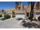 Home exterior highlighting a 2-car garage and desert-style landscaping in a community of attached homes at 2912 E Eberle Ln, Phoenix, AZ 85032