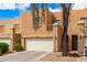 Inviting townhomes featuring two-car garages and charming landscaping to enhance curb appeal and create a welcoming neighborhood at 2912 E Eberle Ln, Phoenix, AZ 85032