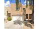 Exterior facade of a two-story home with a two-car garage and front entrance at 2912 E Eberle Ln, Phoenix, AZ 85032