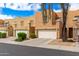 Inviting townhomes featuring two-car garages and charming landscaping to enhance curb appeal and create a welcoming neighborhood at 2912 E Eberle Ln, Phoenix, AZ 85032