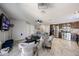 Open living room with modern decor, tile floors, and an open layout to the kitchen at 2912 E Eberle Ln, Phoenix, AZ 85032