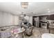 Spacious living area with tile floors and abundant natural light, seamlessly connecting to the kitchen at 2912 E Eberle Ln, Phoenix, AZ 85032