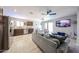 Open living room and kitchen featuring modern decor and tile flooring at 2912 E Eberle Ln, Phoenix, AZ 85032