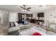 Bright living area showcasing the open layout with the kitchen, creating a comfortable and inclusive space at 2912 E Eberle Ln, Phoenix, AZ 85032
