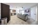 Open living area featuring tile floors, modern decor, and a view of the kitchen at 2912 E Eberle Ln, Phoenix, AZ 85032