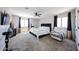Spacious main bedroom featuring plush carpet, ceiling fan and bright windows at 2912 E Eberle Ln, Phoenix, AZ 85032