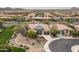 Expansive aerial view of home shows landscaped front yard and circle drive in well-planned community at 29854 N 132Nd Dr, Peoria, AZ 85383