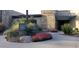 Stylish entrance with stone accents, desert landscaping, and a modern architectural design at 29854 N 132Nd Dr, Peoria, AZ 85383