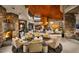 Grand lobby featuring a stone fireplace, wood ceiling, and comfortable seating area at 29854 N 132Nd Dr, Peoria, AZ 85383