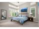 Bright bedroom featuring soft carpet, cool-toned walls, a full bed and bright, natural lighting through multiple windows at 29854 N 132Nd Dr, Peoria, AZ 85383