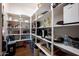 Walk-in pantry with plenty of shelving for storage and organization at 29854 N 132Nd Dr, Peoria, AZ 85383