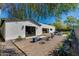 Stylish backyard featuring gravel, flagstone, an outdoor patio and well-manicured trees at 3117 E Campbell Ave, Phoenix, AZ 85016