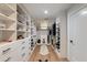 Spacious walk-in closet with custom shelving and ample storage at 3117 E Campbell Ave, Phoenix, AZ 85016