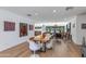 Open-concept dining area showcasing modern art, a unique table, and views of the living spaces at 3117 E Campbell Ave, Phoenix, AZ 85016