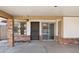 Carport view with brick pillar accents, pedestrian door and sliding glass door at 3326 E Calypso Ave, Mesa, AZ 85204