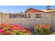 Attractive Sun Trails III community sign adorned with vibrant pink bougainvillea at 3326 E Calypso Ave, Mesa, AZ 85204
