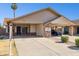 Charming house with a carport, brick accents, and mature landscaping at 3326 E Calypso Ave, Mesa, AZ 85204