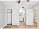 Hallway view featuring closets and a view of the vanity and mirror in bathroom at 3326 E Calypso Ave, Mesa, AZ 85204