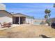 Large backyard showcasing a covered patio, dining set, and fenced pool area at 3405 S Cutler Dr, Tempe, AZ 85282