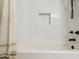 Modern bathroom features a soaking tub, sleek white subway tile surround, and a stylish shower head at 3405 S Cutler Dr, Tempe, AZ 85282