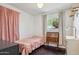 Inviting bedroom featuring a comfortable bed, vintage desk and ample natural light at 3405 S Cutler Dr, Tempe, AZ 85282