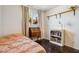 Sunlit bedroom featuring a comfy bed, vintage desk and shelving unit at 3405 S Cutler Dr, Tempe, AZ 85282