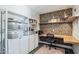 Stylish home office featuring built-in shelving, a wood desk, and modern decor at 3405 S Cutler Dr, Tempe, AZ 85282