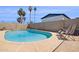 Private backyard oasis with a sparkling pool, desert landscaping, and lounge chairs at 3405 S Cutler Dr, Tempe, AZ 85282