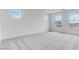 Bright bedroom with plush carpet, white walls and multiple windows allowing for abundant natural light at 3974 E Ghost Flower Ln, San Tan Valley, AZ 85140